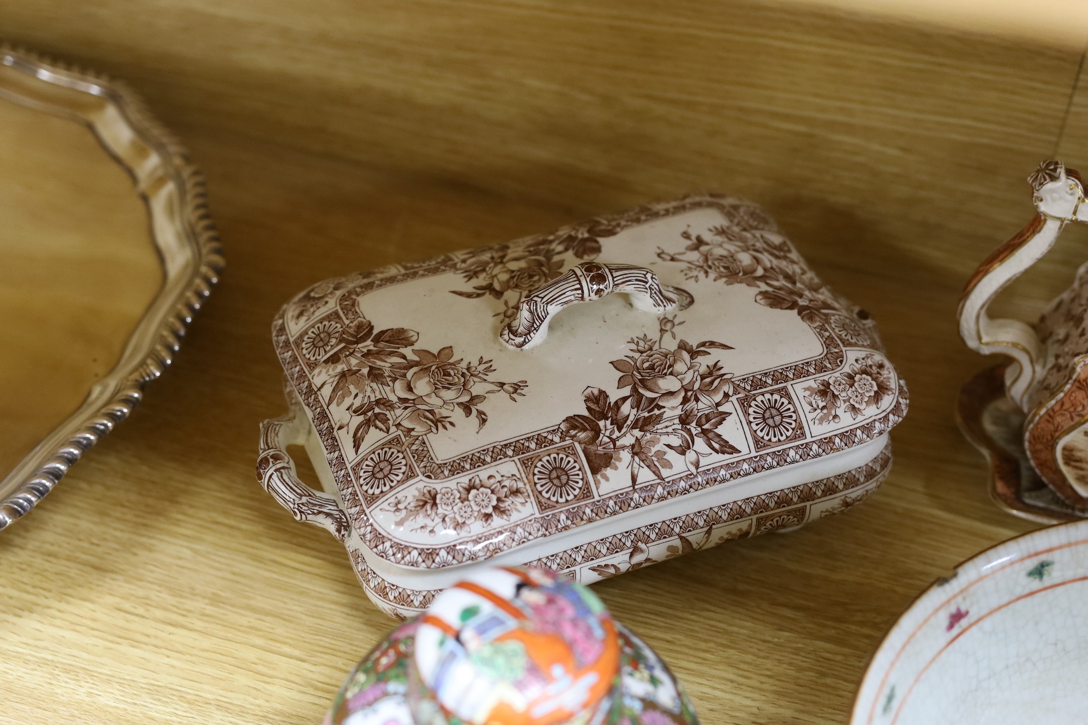 A group of mixed ceramics and an enamel brush